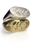 Handcrafted Branch Signet ring featuring silver or gold-plated ovals, each adorned with an intricate olive leaf engraving, showcasing a unique blend of modern and classical aesthetics