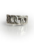 Sterling silver chain link band ring with intricately detailed, hand-shaped design showcasing a timeless aesthetic. Meticulously crafted wax-cast jewelry piece reflecting artisanal quality and unique style.