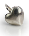 Elegant silver heart-shaped pendant with smooth, polished surface reflecting light, showcasing a classic symbol of love and affection as a stylish jewelry piece for Shopify product "Full Hearts"