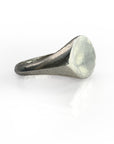 Sterling silver oval signet ring with smooth, polished finish and organic wax-molded design. Handcrafted jewelry piece featuring a unique oval-shaped bevel on a classic signet style band, showcasing artisanal craftsmanship and timeless elegance.