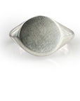 Handcrafted oval mirror signet ring in sterling silver with unique organic texture, featuring a smooth bevel and polished finish, perfect for custom engraving or as a statement piece