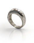 Handcrafted sterling silver Pumice Statement ring with unique textured surface, inspired by volcanic lava glass. Wide band with hammered, porous-looking design reflecting natural pumice formation. Elegant, organic-inspired jewelry piece.