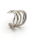 Silver triple-segmented j-hoop earring with wavy design, inspired by ocean tides. Shiny sterling silver loops create a unique statement piece, reflecting light and showcasing intricate craftsmanship. Elegant and modern jewelry for water-inspired style.