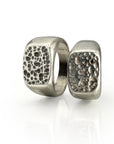 Square Pumice Signet rings with intricate porous texture resembling volcanic lava glass, cast in sterling silver with unique natural patterns, showcasing the beauty of nature-inspired jewelry design