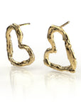 Textured gold heart-shaped stud earrings with unique hand-sculpted design, featuring irregular surface patterns and delicate contours, reflecting light for a shimmering effect, perfect for expressing love and style