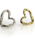 Elegant textured heart earrings in silver and gold, showcasing hand-sculpted designs with a unique, organic texture. The open heart shapes reflect light beautifully, symbolizing eternal love in a stylish, contemporary form perfect for everyday wear or special occasions.