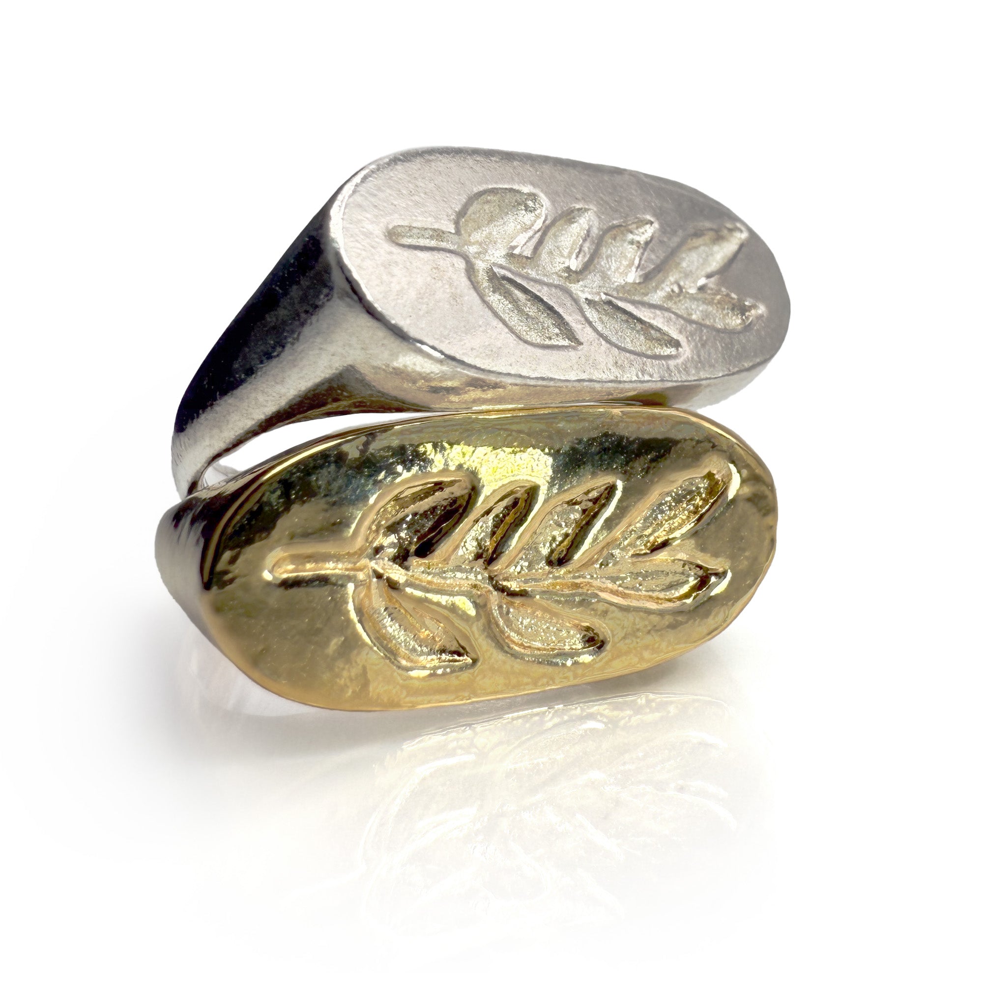 Handcrafted Branch Signet ring featuring silver or gold-plated ovals, each adorned with an intricate olive leaf engraving, showcasing a unique blend of modern and classical aesthetics