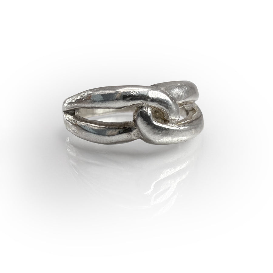 Handcrafted sterling silver Love Knot Band ring with intertwined design symbolizing eternal love and togetherness, featuring a shiny finish and unique knotted pattern