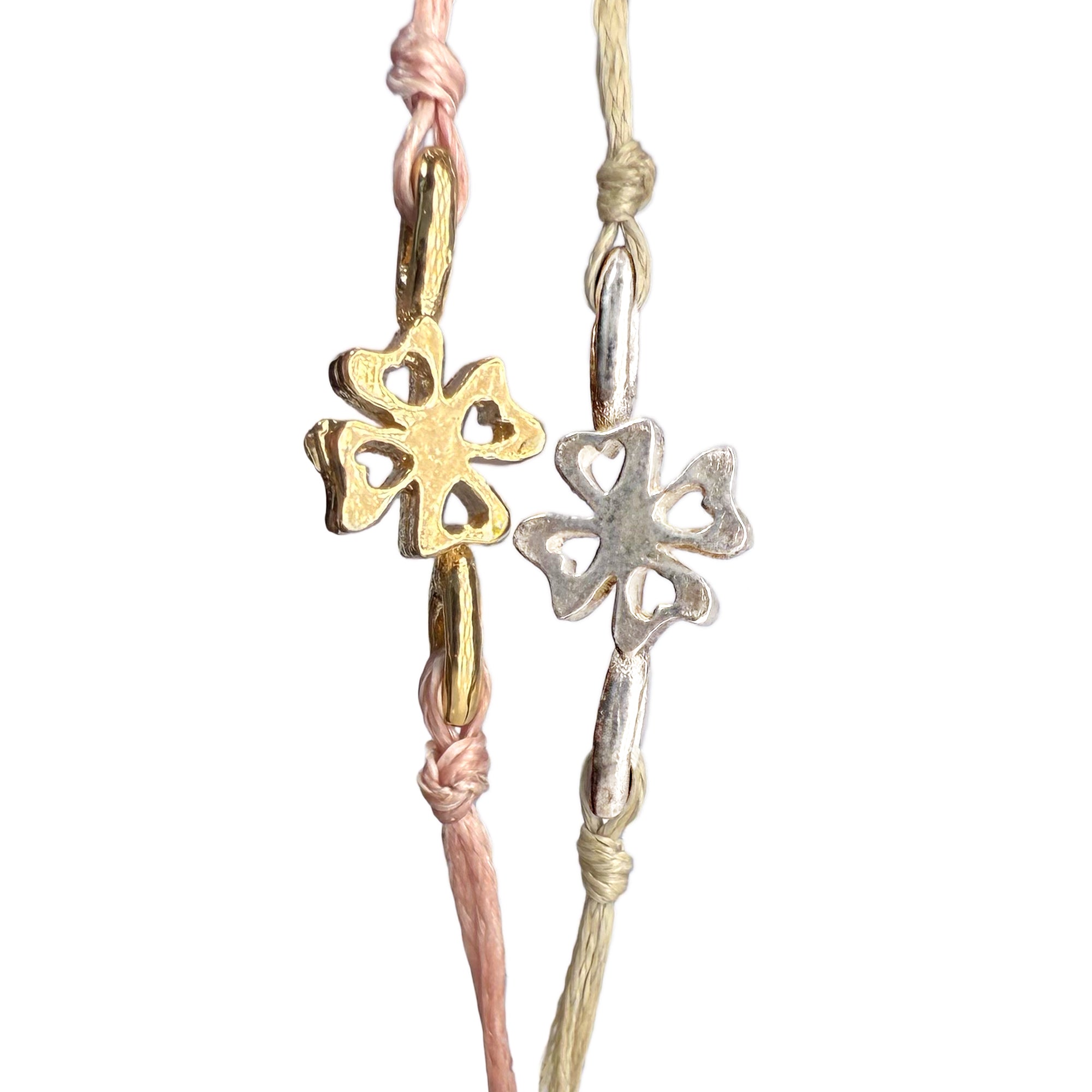 Delicate Lucky Clovers bracelets featuring gold and silver four-leaf clover charms, showcasing intricate heart-shaped cutouts in the clover design for a stylish and fortunate accessory