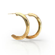 Elegant gold-plated J-hoop earrings, Slate Hoop design, featuring a curved crescent shape with a smooth, polished finish. Understated yet sophisticated jewelry piece ideal for complementing classic outfits.